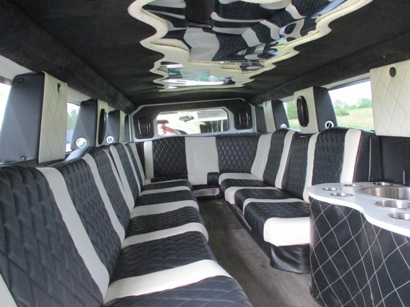 2005 White /White/Black Hummer H2 , located at 1725 US-68 N, Bellefontaine, OH, 43311, (937) 592-5466, 40.387783, -83.752388 - 2005 Hummer H2 175" SUV VIP Limousine, White w/White/black leather interior, Front/Rear Ait, Flat Screens, AM/FM/CD reconditioned Interior, LOADED - Photo #8